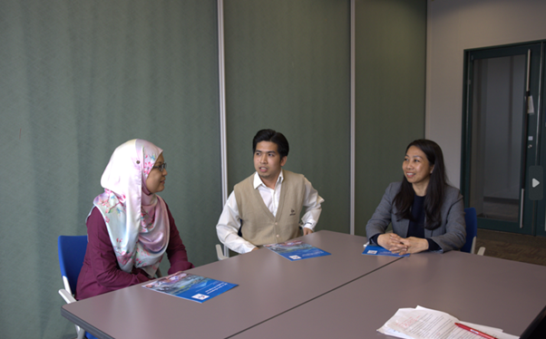 Ms. Nuraini Binti Muhammad Naim (left), Mr. Louie Hitosis (center), and Ms. Seng Tynei (right) engaged in a discussion. 