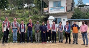 Employees of the Hokken who visited the area in Nepal with a JICA official