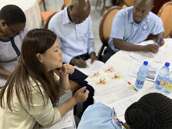 Hosono discussing with local stakeholders.