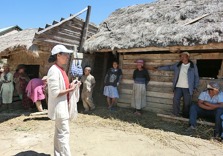 An extension worker talking to residents.