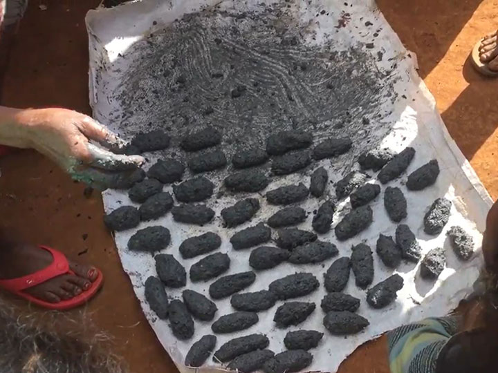 Charcoal made of grass and mud.