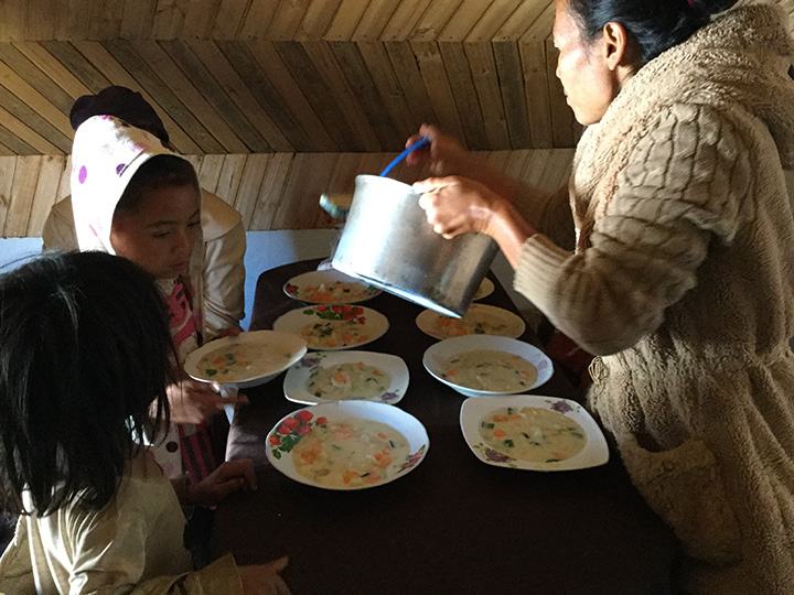 Stew being served at a table.