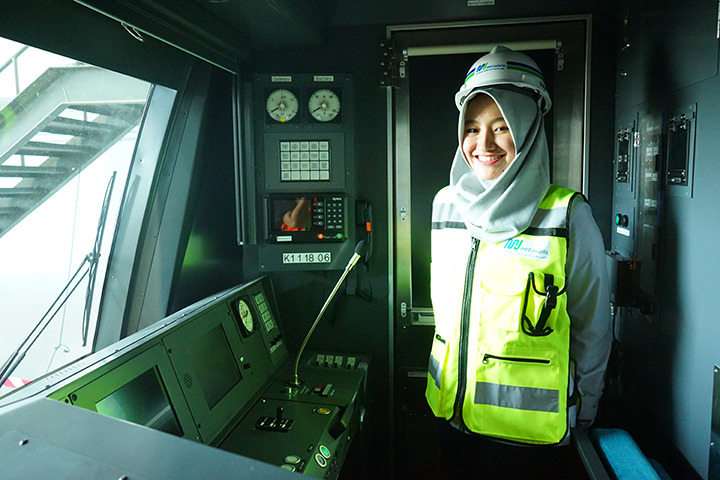 An Indonesian technician engages in vehicle maintenance