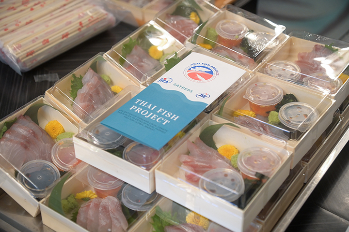 Asian seabass sashimi cultured with alternative feed sources, being served at a tasting events.