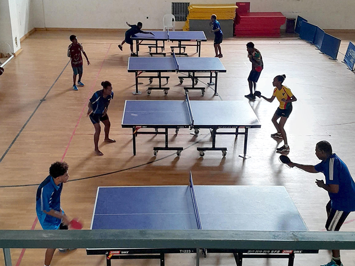 The gymnasium with four table tennis tables where the Vanuatu national team practices.