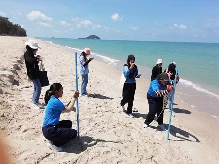Students surveying the coast in Songkhla, Thailand