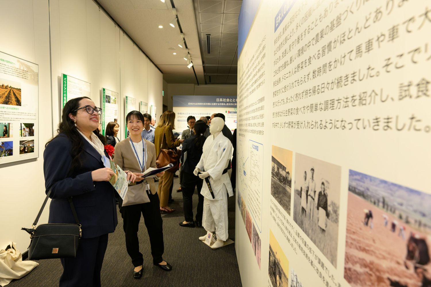 Visitors view panels at the special exhibition.