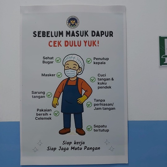 Photo: Various hygiene reminders are posted in the school kitchen for the safe provision of school meals