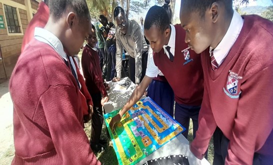 Learners playing the GBV life board game