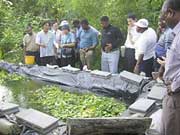 Participants exchanged ideas with a Thai farmer at his successful sufficient economy farm.
