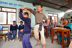 A JOCV dancing with a student at a school for children with disabilities in Nepal