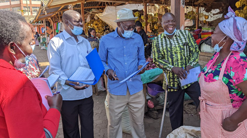 Mr Ayub (second person from the right) interviewed conducting the market survey