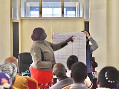 The female farmer presented her record keeping method as reference to other farmers.