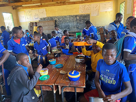 Eating together the food made during the cooking exercise.