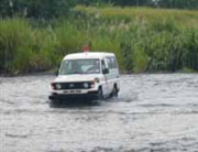 Ambulance Crossing on Riverbed